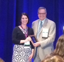 Dr. Mezuk receiving her award